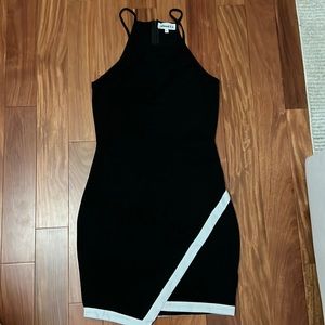 Black and white dress with asymmetrical hemline. Size small